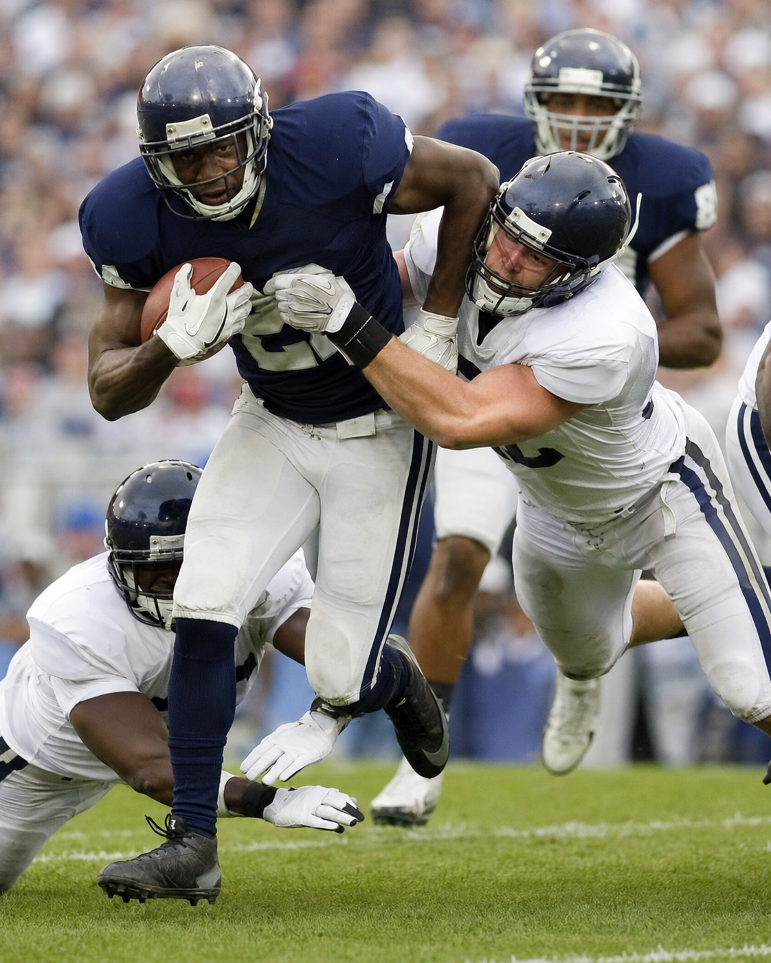 Football players competing during a game